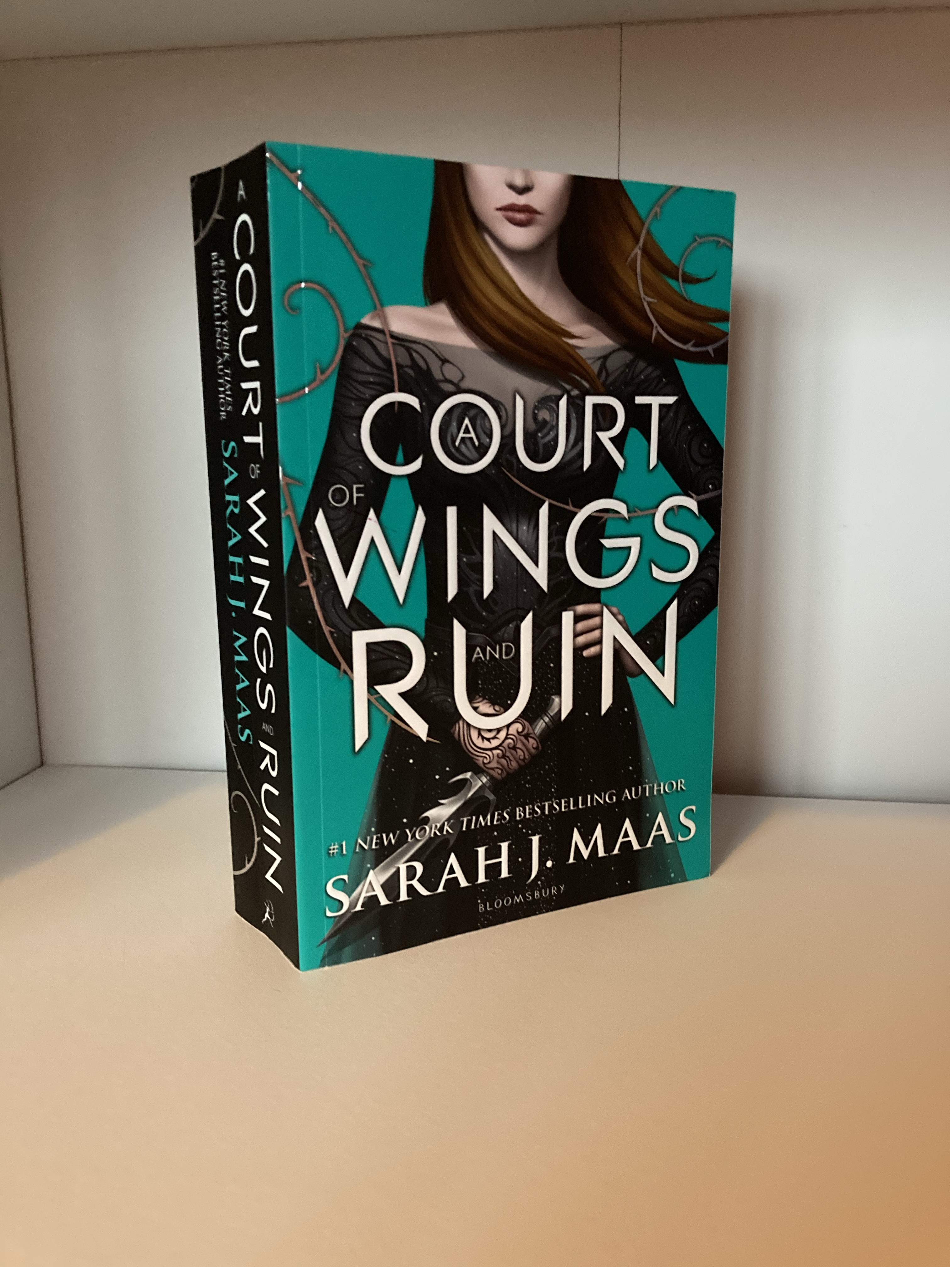 The cover of A Court of Wings and Ruin by Sarah J. Maas
